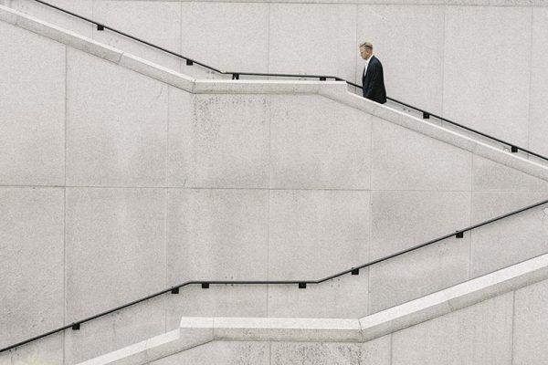 Businessman walking up steps