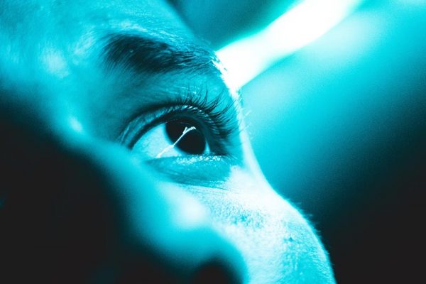 Close up of man looking towards light